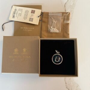 Burberry new with tags, ocean blue marble letter U charm with unbranded chain‎